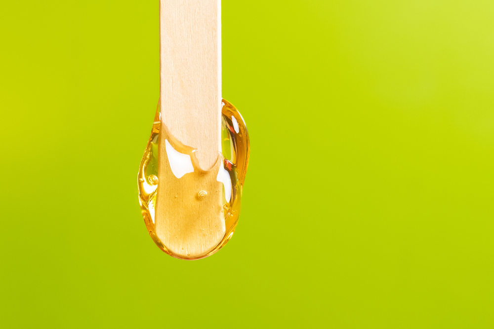 wax for hair removing spatula with wooden framing sticks